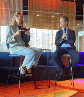 Maxime moderating a fireside chat